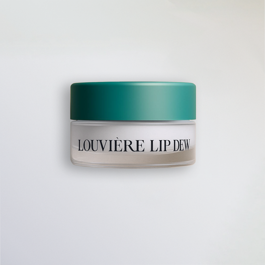 a premium lip balm designed to hydrate, smooth, and plump lips. Close up image of the Louvière Lip Dew in a glass jar. 
