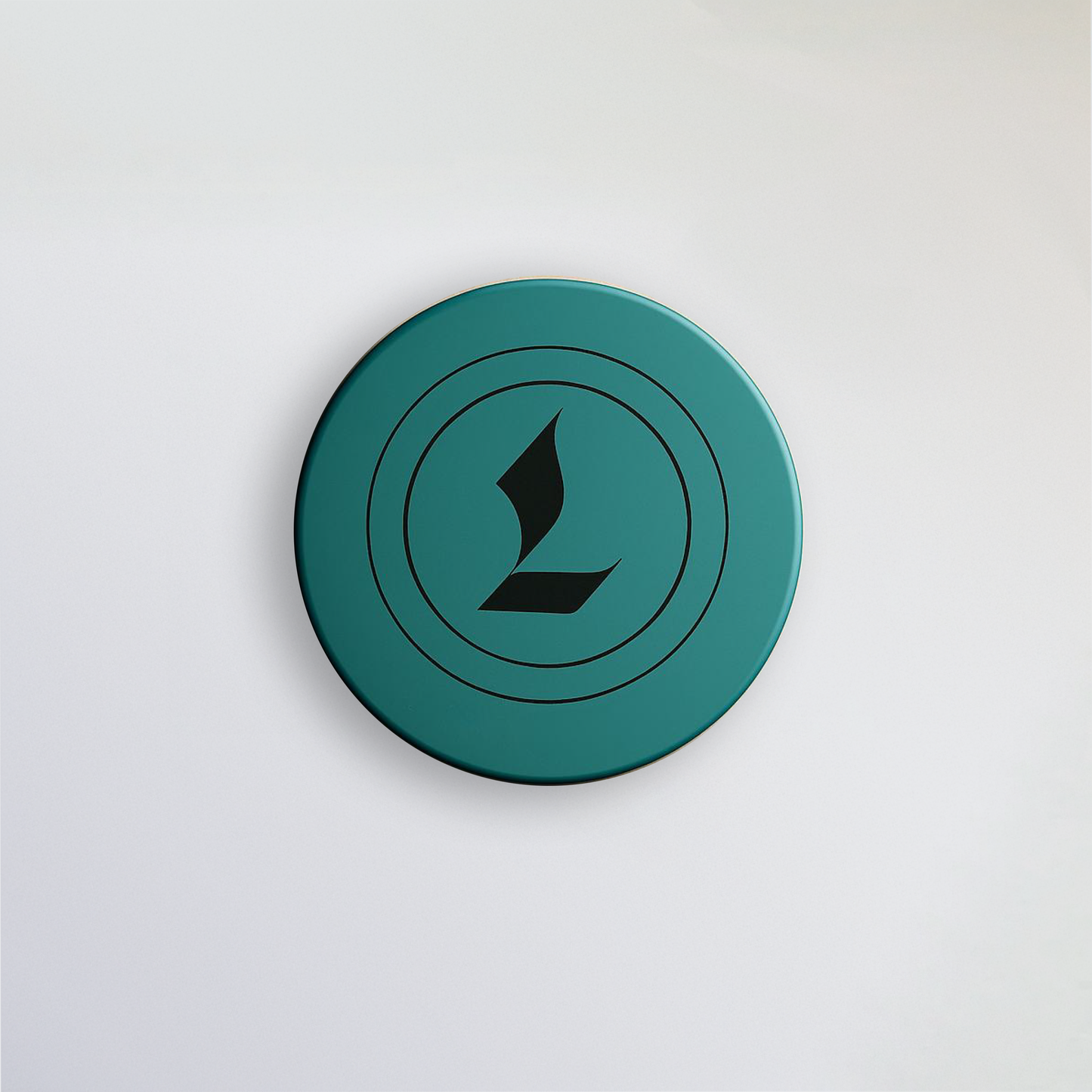 Aerial image of Louviere Lip Dew. Signature color is eagle green. Louviere's L shaped logo is imprinted on the top of the cap.