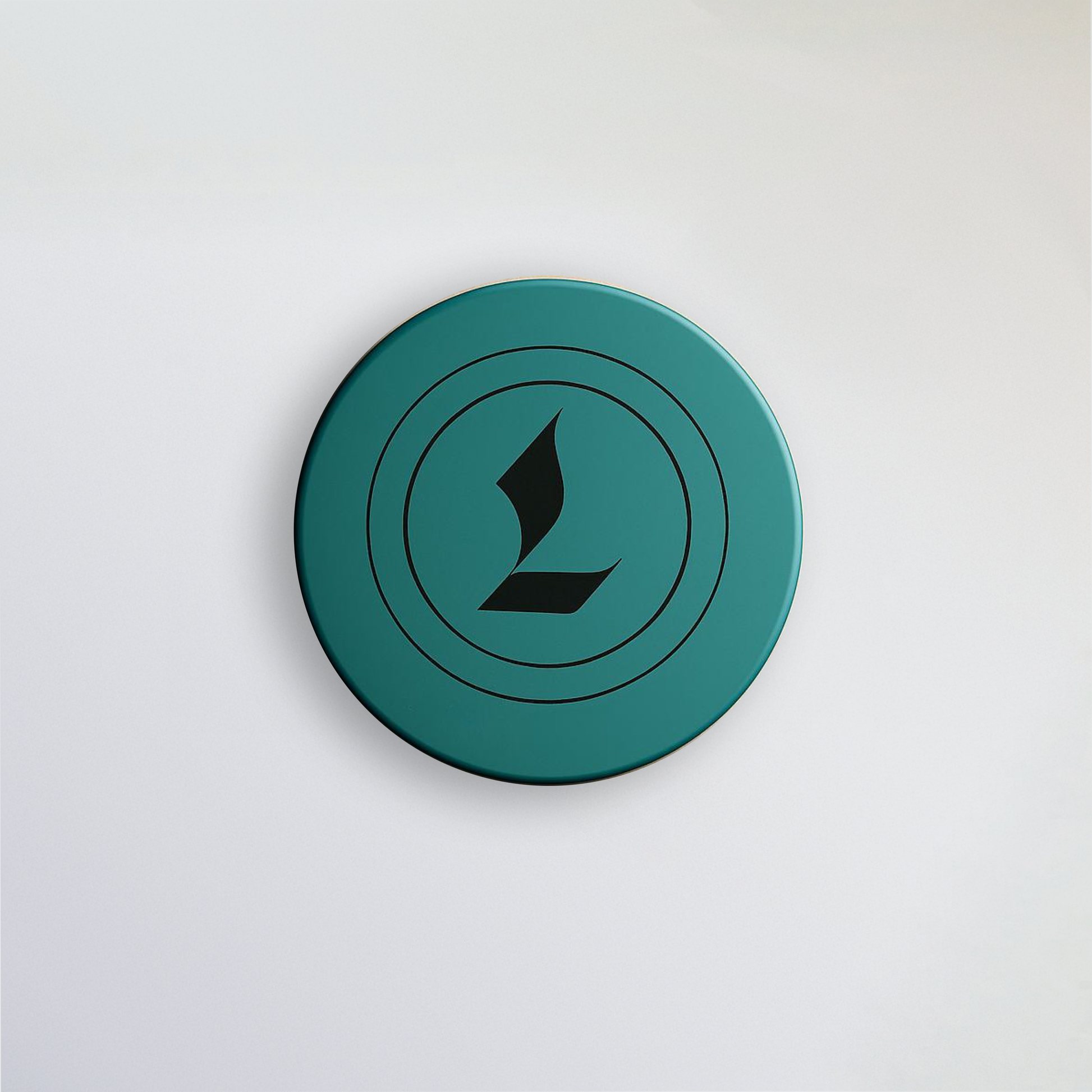 Aerial image of Louviere Lip Dew. Signature color is eagle green. Louviere's L shaped logo is imprinted on the top of the cap.