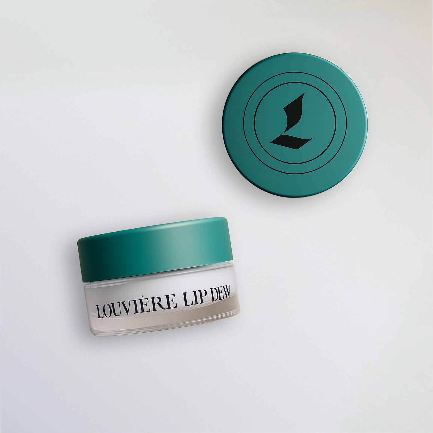 Louvière Lip Dew, a premium lip balm designed to hydrate, smooth, and plump lips. Shot from front and aerial angle.